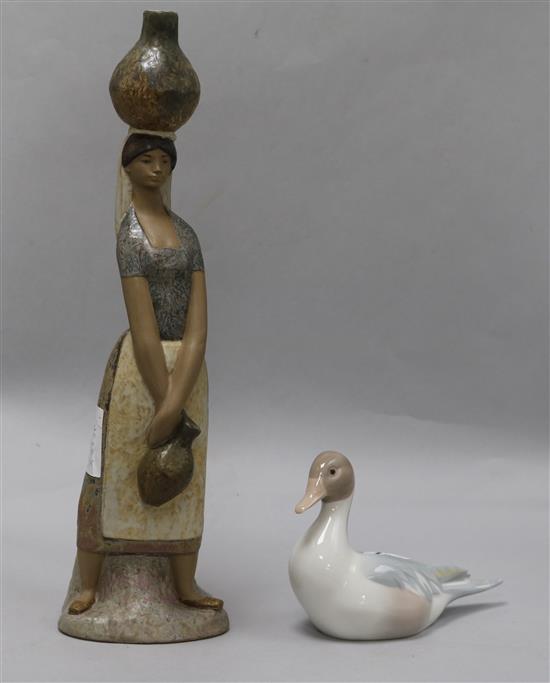 A Lladro water carrier and a Lladro duck